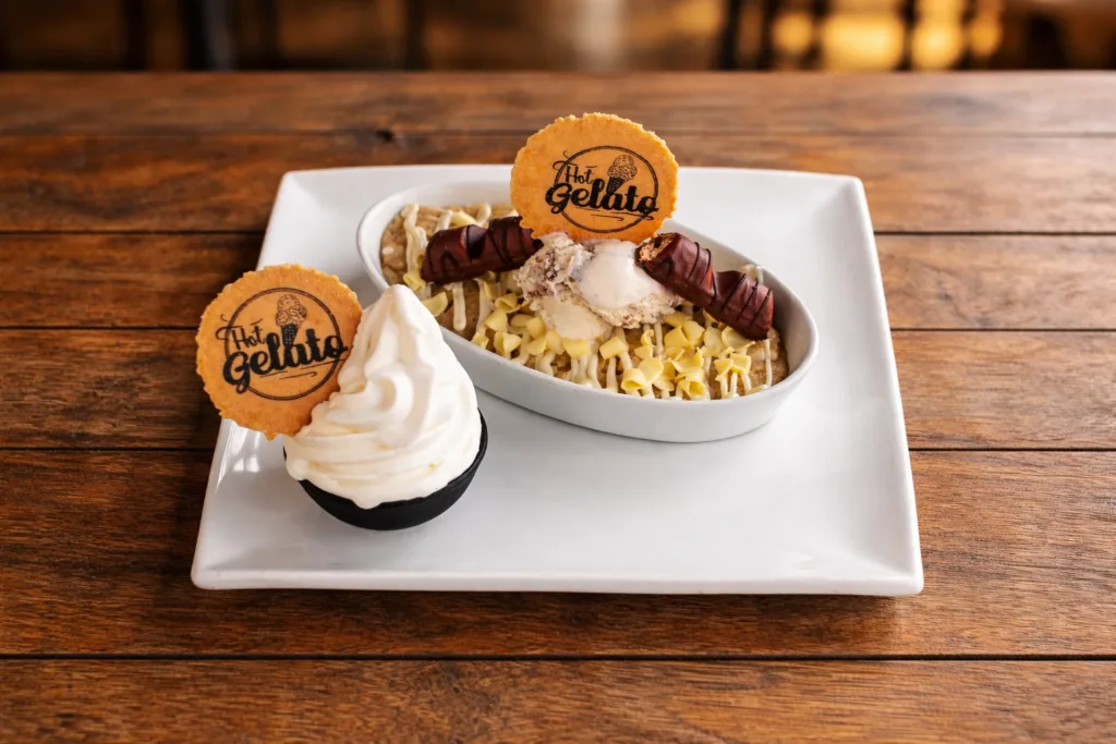 Warm cookie dough dessert with ice cream and chocolate toppings at Hot Gelato Eastbourne