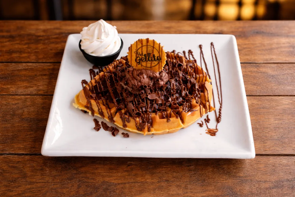 Chocolate waffle dessert with ice cream and chocolate drizzle at Hot Gelato Eastbourne